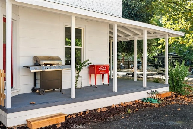 wooden deck featuring area for grilling