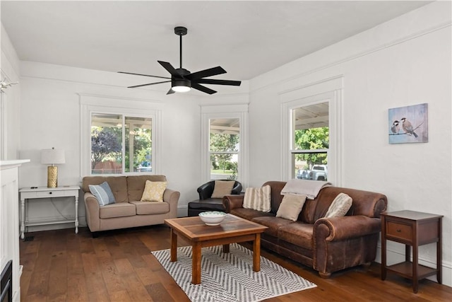 living room with dark hardwood / wood-style floors and ceiling fan