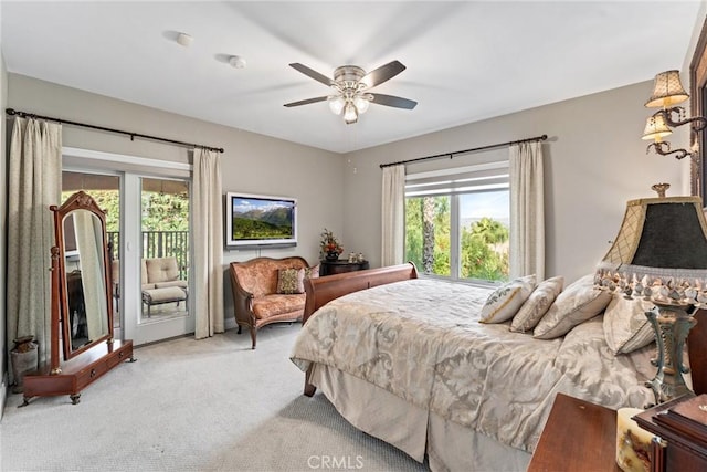 bedroom with access to exterior, ceiling fan, and light colored carpet