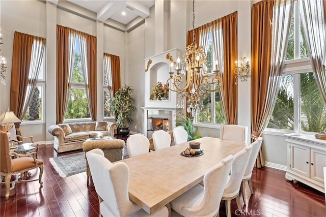 sunroom / solarium with beamed ceiling and a chandelier