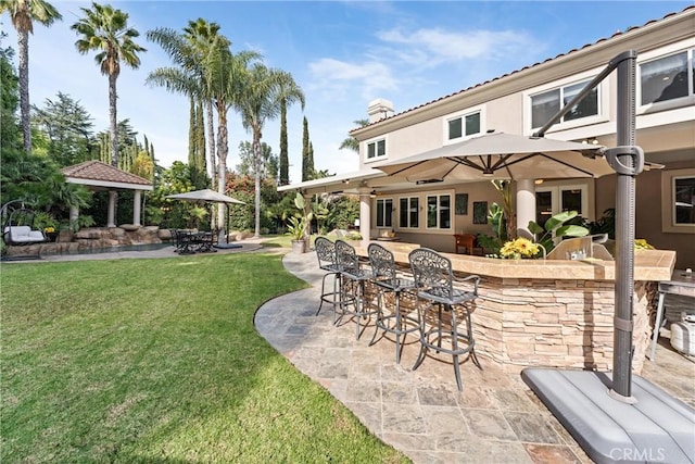 view of patio with a bar