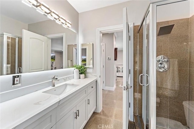 bathroom featuring vanity and walk in shower