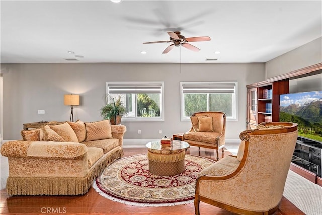 living room with ceiling fan and hardwood / wood-style flooring