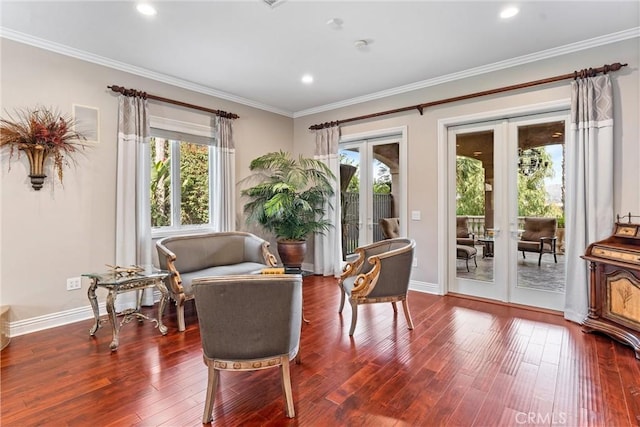 sitting room with dark hardwood / wood-style flooring, a wealth of natural light, and french doors