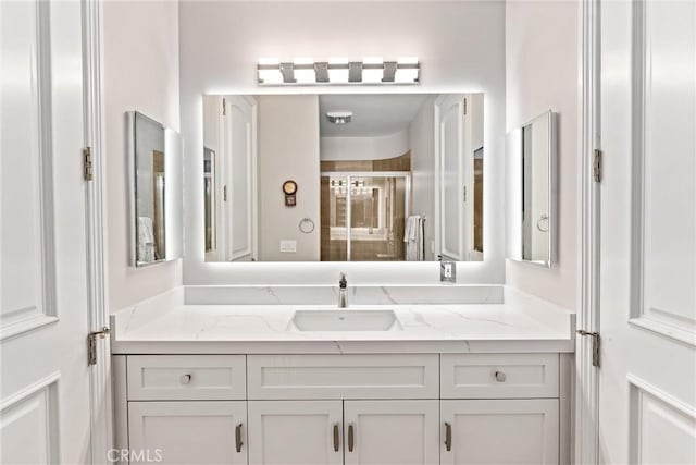 bathroom with vanity and walk in shower