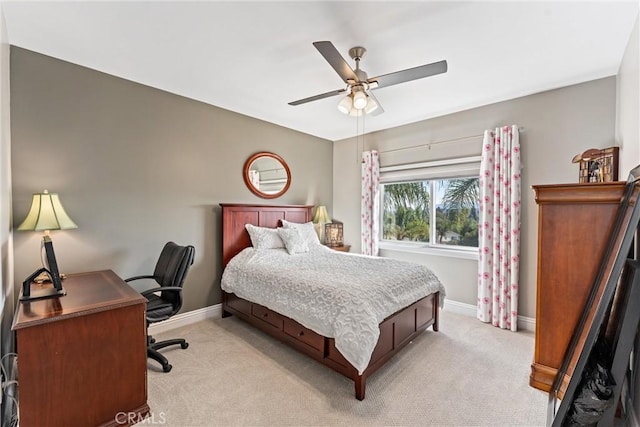 bedroom featuring ceiling fan and light carpet