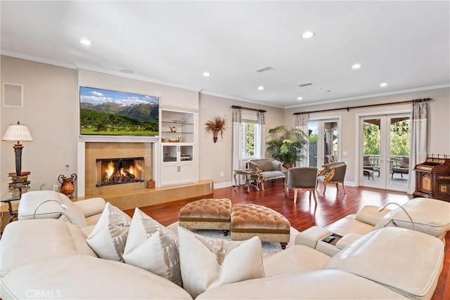 living room with hardwood / wood-style flooring and a wealth of natural light