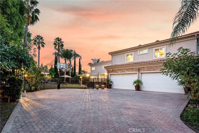 mediterranean / spanish-style house with a garage