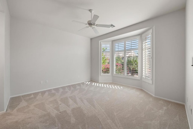 empty room with light carpet and ceiling fan