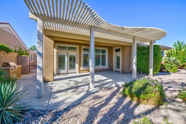 view of patio / terrace featuring a pergola and grilling area