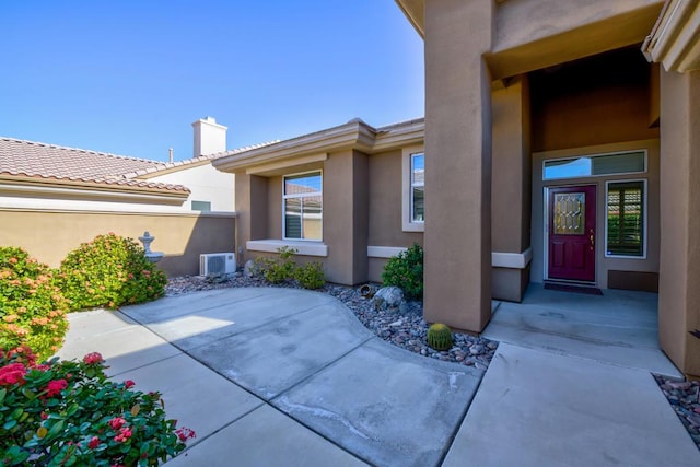 property entrance featuring a patio area