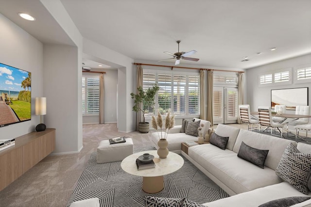 carpeted living room featuring ceiling fan