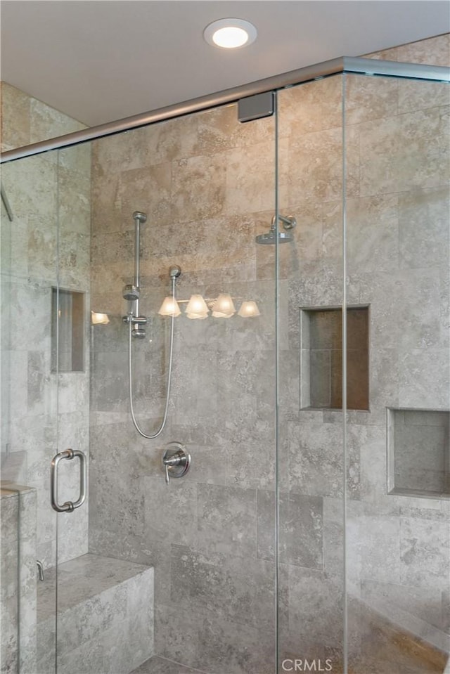 bathroom featuring an enclosed shower