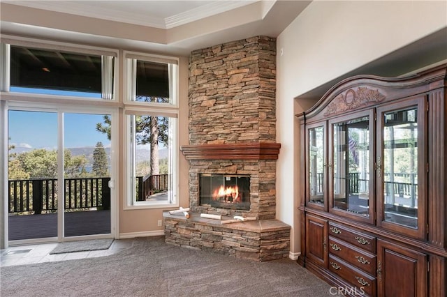 27554 N Bay Rd, Lake Arrowhead, CA 92352 - unfurnished living room with carpet flooring, a stone fireplace, and ornamental molding