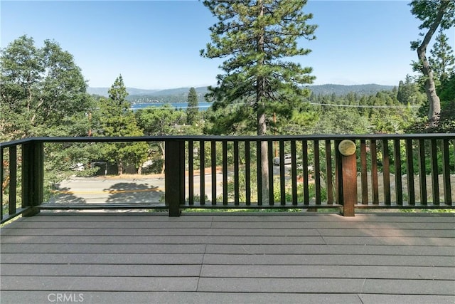 wooden deck with a mountain view