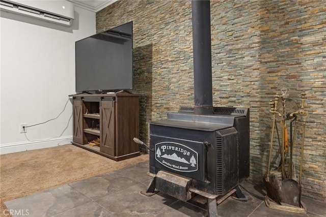 interior details featuring a wood stove, a wall mounted AC, and crown molding