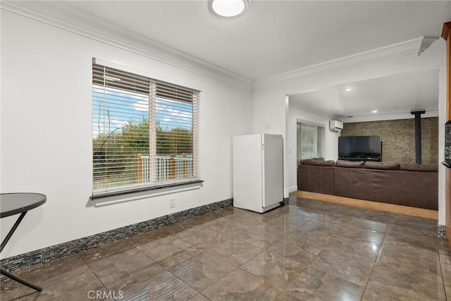 unfurnished living room featuring an AC wall unit and ornamental molding