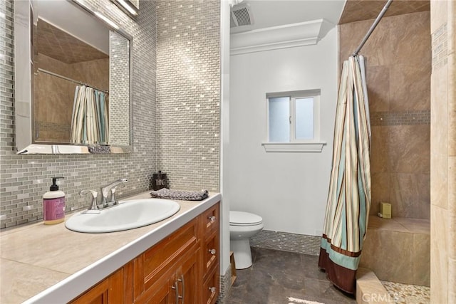 bathroom featuring tasteful backsplash, toilet, vanity, and walk in shower