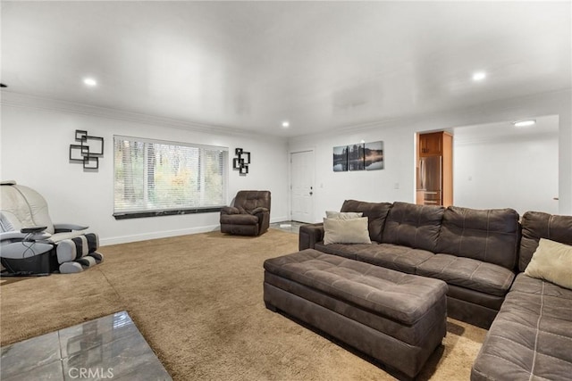 carpeted living room featuring crown molding