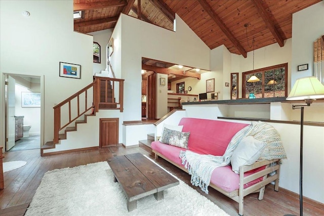 living room with high vaulted ceiling, dark hardwood / wood-style floors, wood ceiling, and beam ceiling