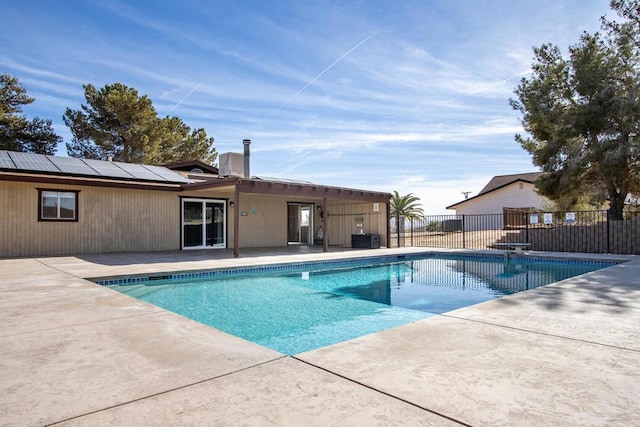 view of pool with a patio area and central AC