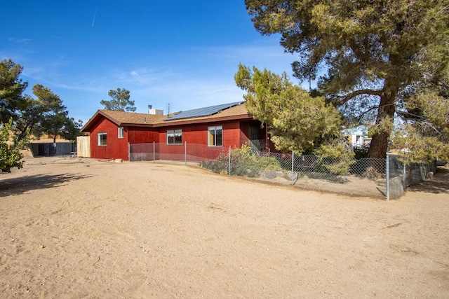 view of front of house with solar panels