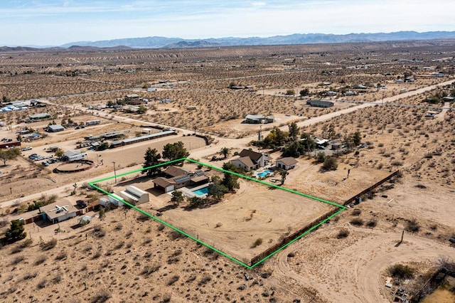 drone / aerial view featuring a mountain view