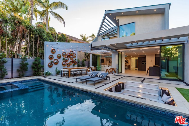 view of swimming pool with a patio area and an outdoor hangout area