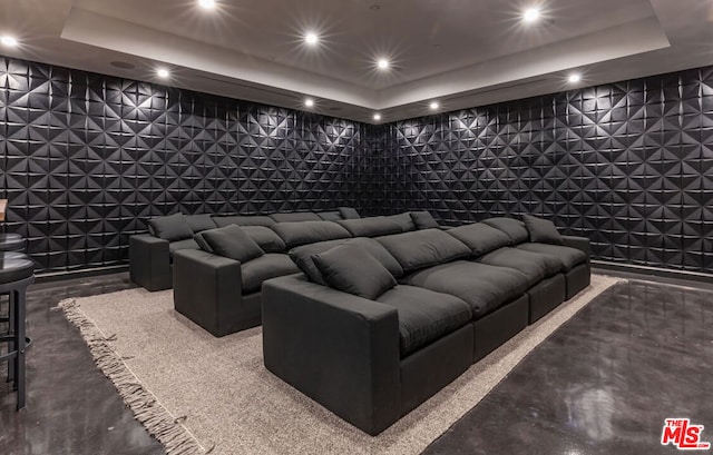 home theater with a raised ceiling