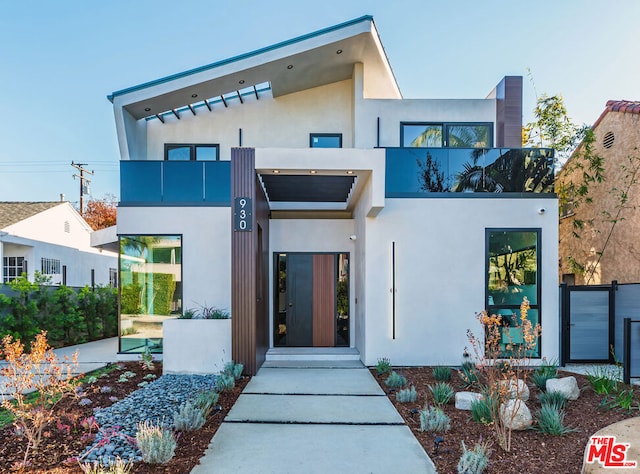 view of front of home with a balcony