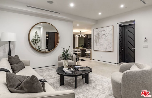 living room with an inviting chandelier