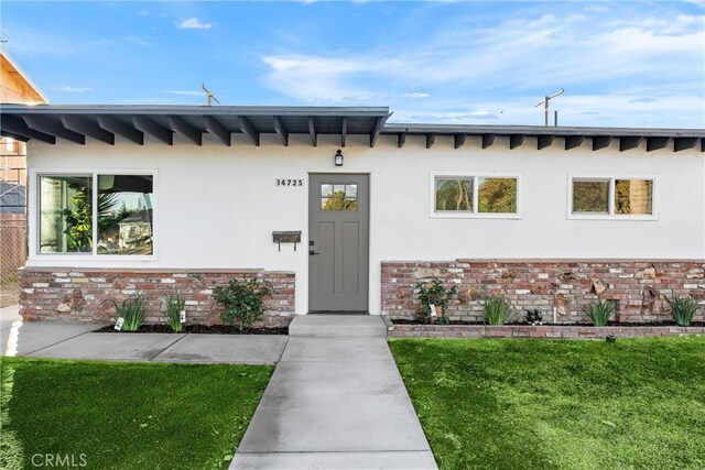 entrance to property with a yard