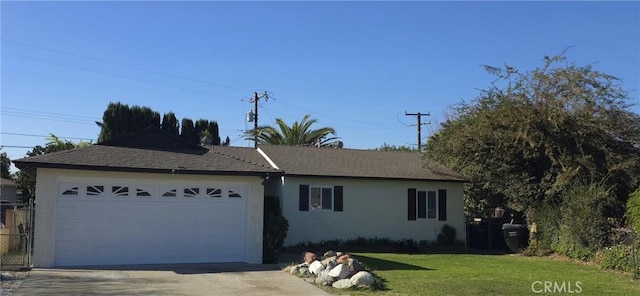 ranch-style home with a front lawn and a garage