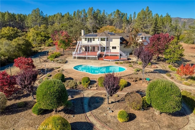 view of swimming pool featuring a deck