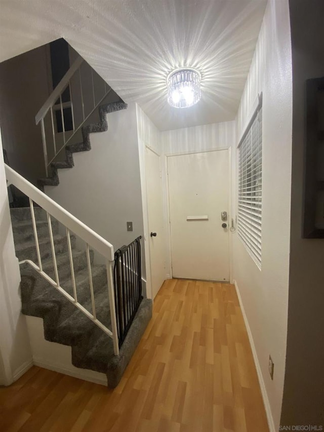 staircase with wood-type flooring