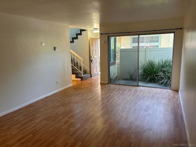 empty room featuring wood-type flooring