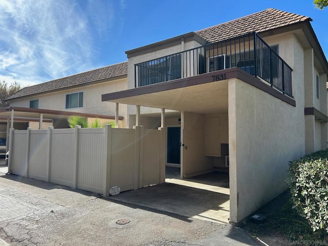 rear view of property with a balcony