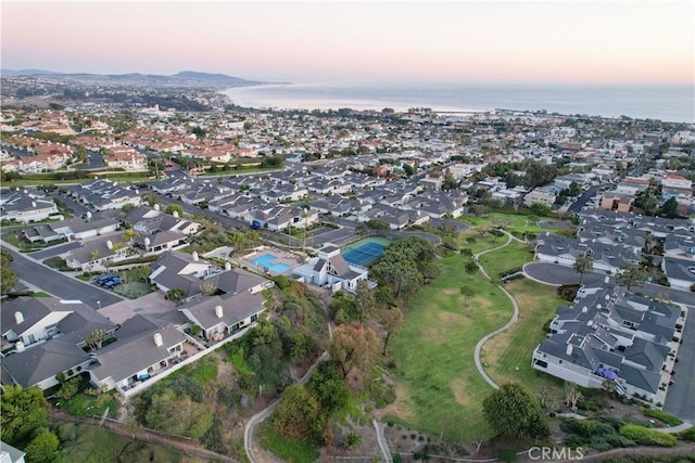 aerial view at dusk with a water view