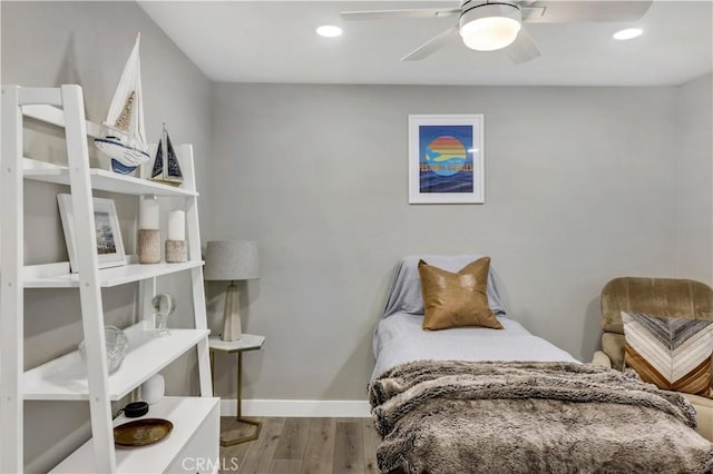 bedroom with light wood-type flooring and ceiling fan