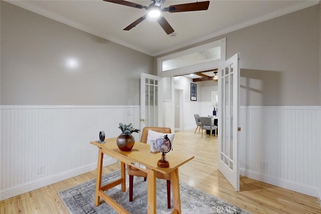 office area with light hardwood / wood-style floors, ornamental molding, and french doors