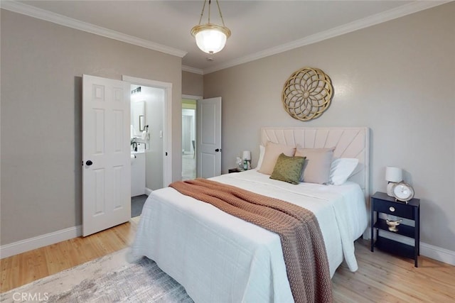 bedroom with crown molding and light hardwood / wood-style floors