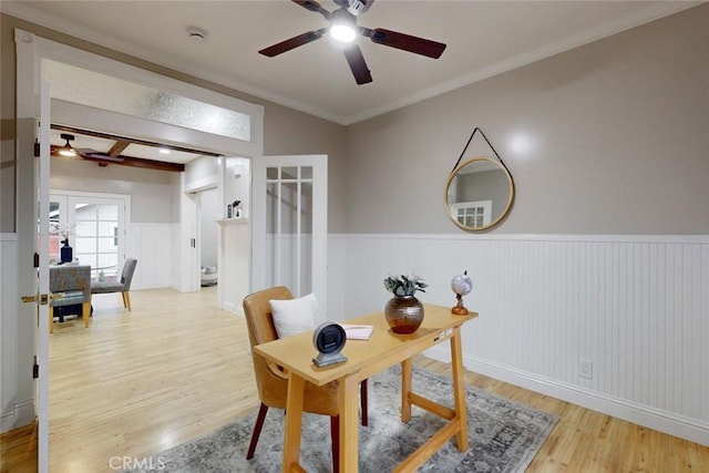 home office with crown molding, french doors, beamed ceiling, and light hardwood / wood-style floors