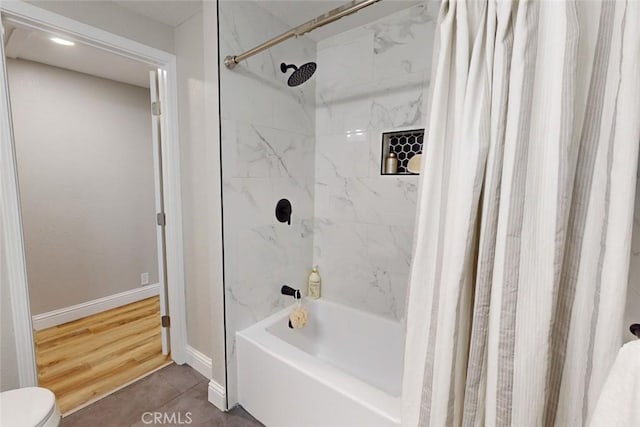 bathroom featuring hardwood / wood-style floors and shower / tub combo with curtain