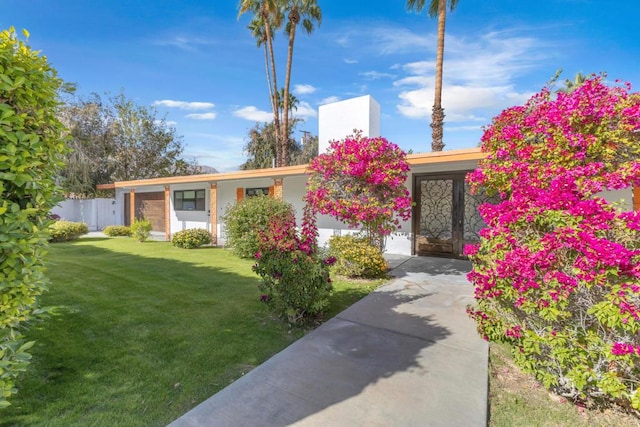 view of front of property with a front lawn