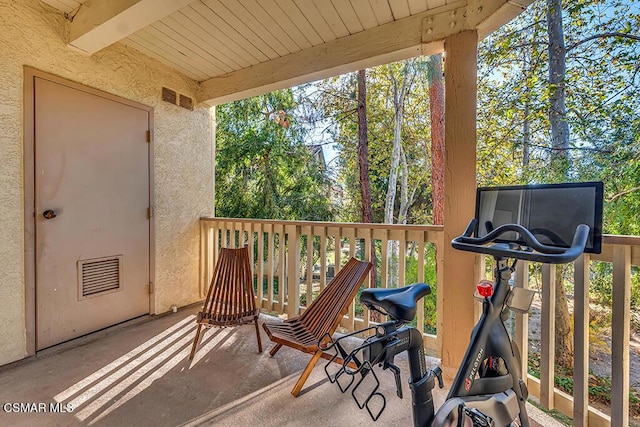 view of patio featuring a balcony