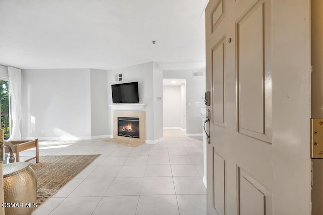 tiled living room with a fireplace