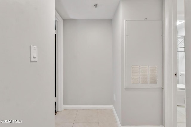 hallway with light tile patterned floors