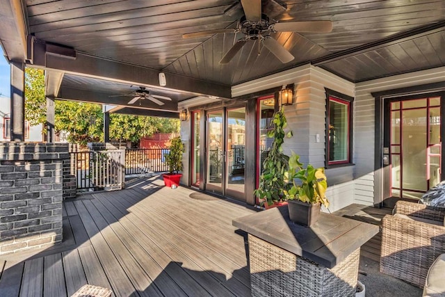 wooden terrace with ceiling fan and french doors