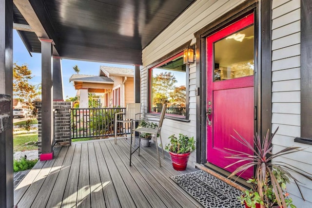 wooden deck featuring covered porch