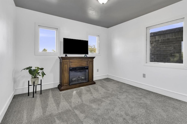 unfurnished living room featuring carpet flooring